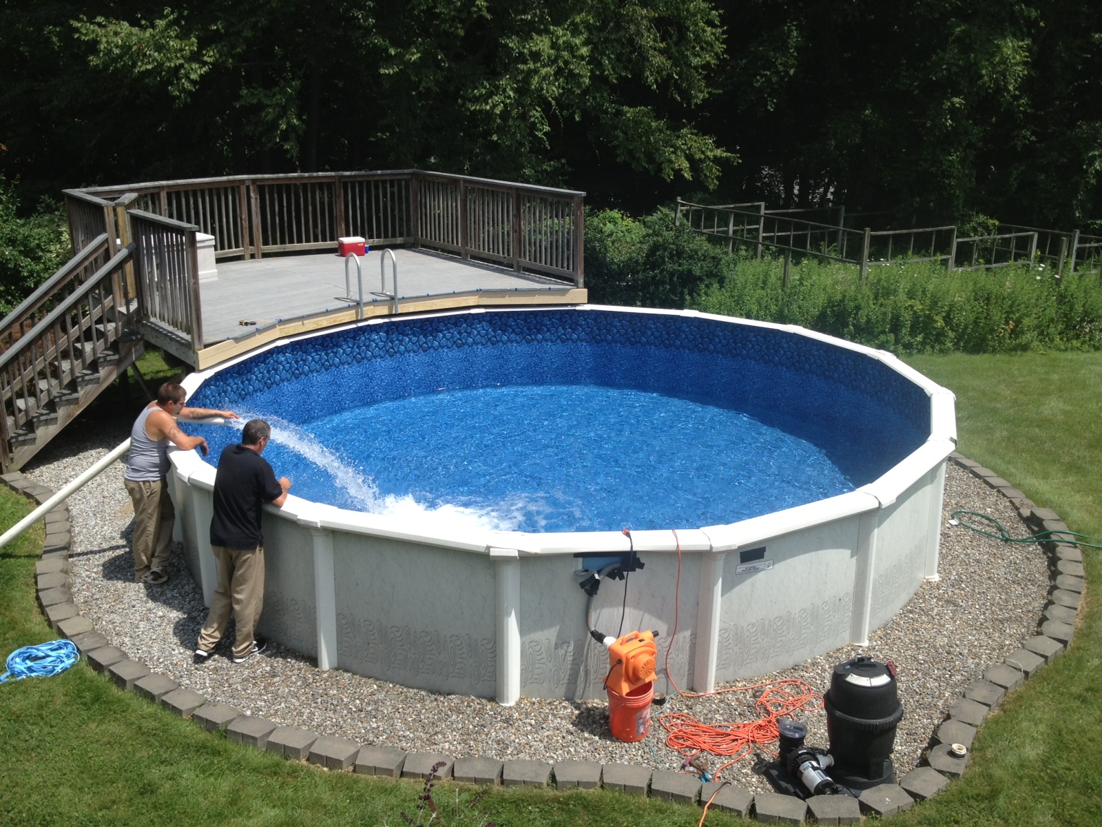 Round steel-wall above-ground pool installed in a backyard